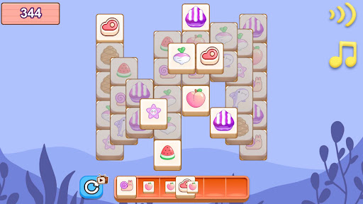 A Pile Snap board with stacked dessert and fruit tiles above the tray.